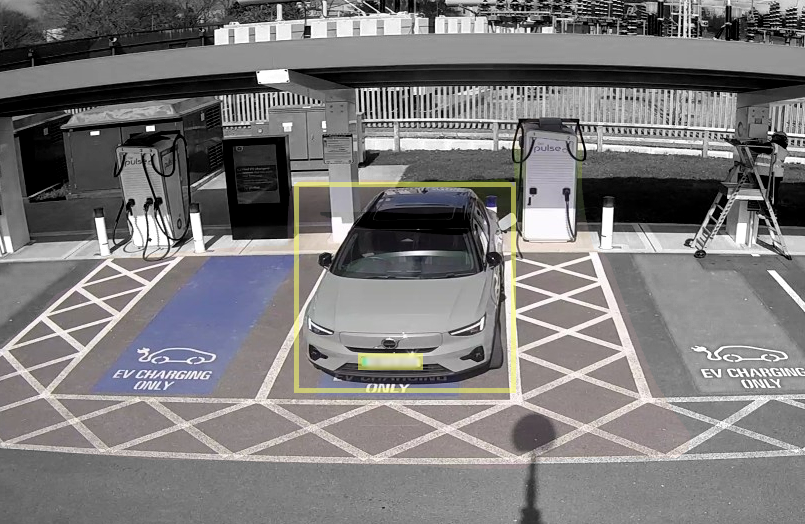 Electric vehicle charging cluster in Birmingham with a car charging